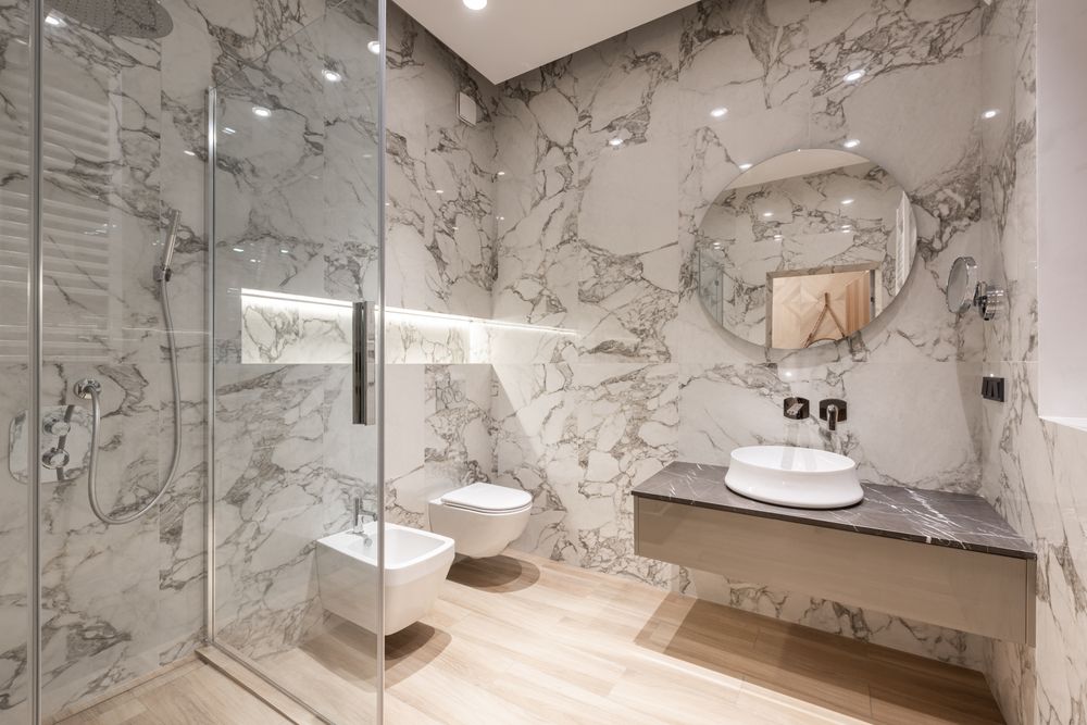Finished bathroom with a walk-in shower after renovation